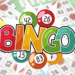 A sign that says BINGO with numbered balls and bingo cards.