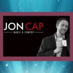 Logo and picture of Magician Jon Cap, Magic and Comedy, on a black background with a burgundy frame and a blue spotlight.