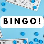 The word Bingo! on a blue background with bingo cards and tokens in the background.