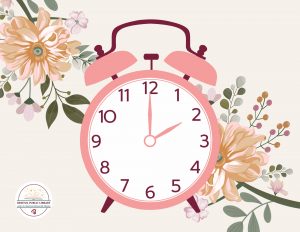 A pink clock at 2:00 PM on a background of flowers.