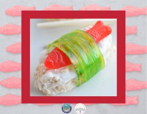 A candy sushi with a red Swedish fish and a green fruit rollup on a Rice Krispie treat.