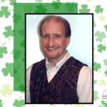 The Storyteller on a background of shamrocks.