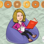 A woman sitting on a bean bag chair with coffee, a book, and bagels.
