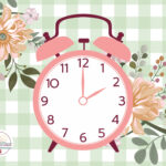 A clock showing 2:00 o'clock and flowers.