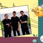 Members of the We3 Trio Band, along with a happy face blowing a noisemaker.
